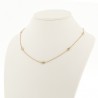 Collier en or 18 carats, serti de 7 diamants ronds recto-verso