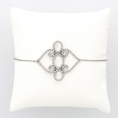 Bracelet motif volute pavé serti mini griffes diamants 1,06 carat-or 18 carats