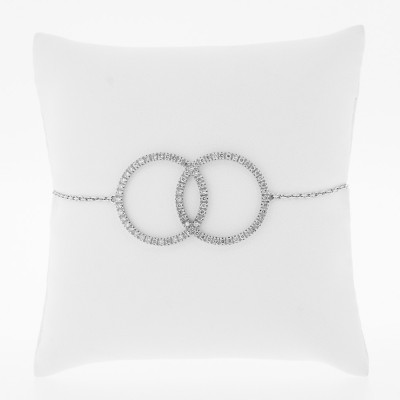 Bracelet deux cercles entrecroisés pavés de diamants sertis mini-griffes en or 18 carats