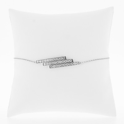 Bracelet avec trois barrettes superposées pavées de diamants sertis grains en or 18 carats