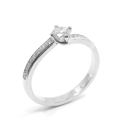 Solitaire or et diamants Tourbillon. Chaton torsadé avec un diamant de 0,28 ct et corps serti de diamants - or 18 carats