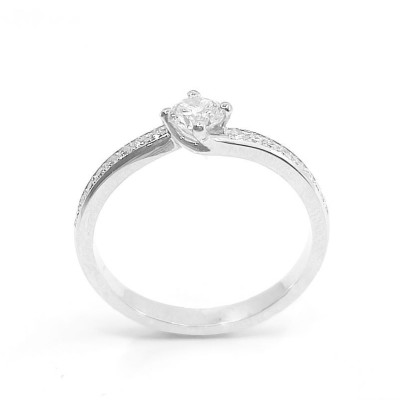 Solitaire or et diamants Tourbillon. Chaton torsadé avec un diamant de 0,28 ct et corps serti de diamants - or 18 carats